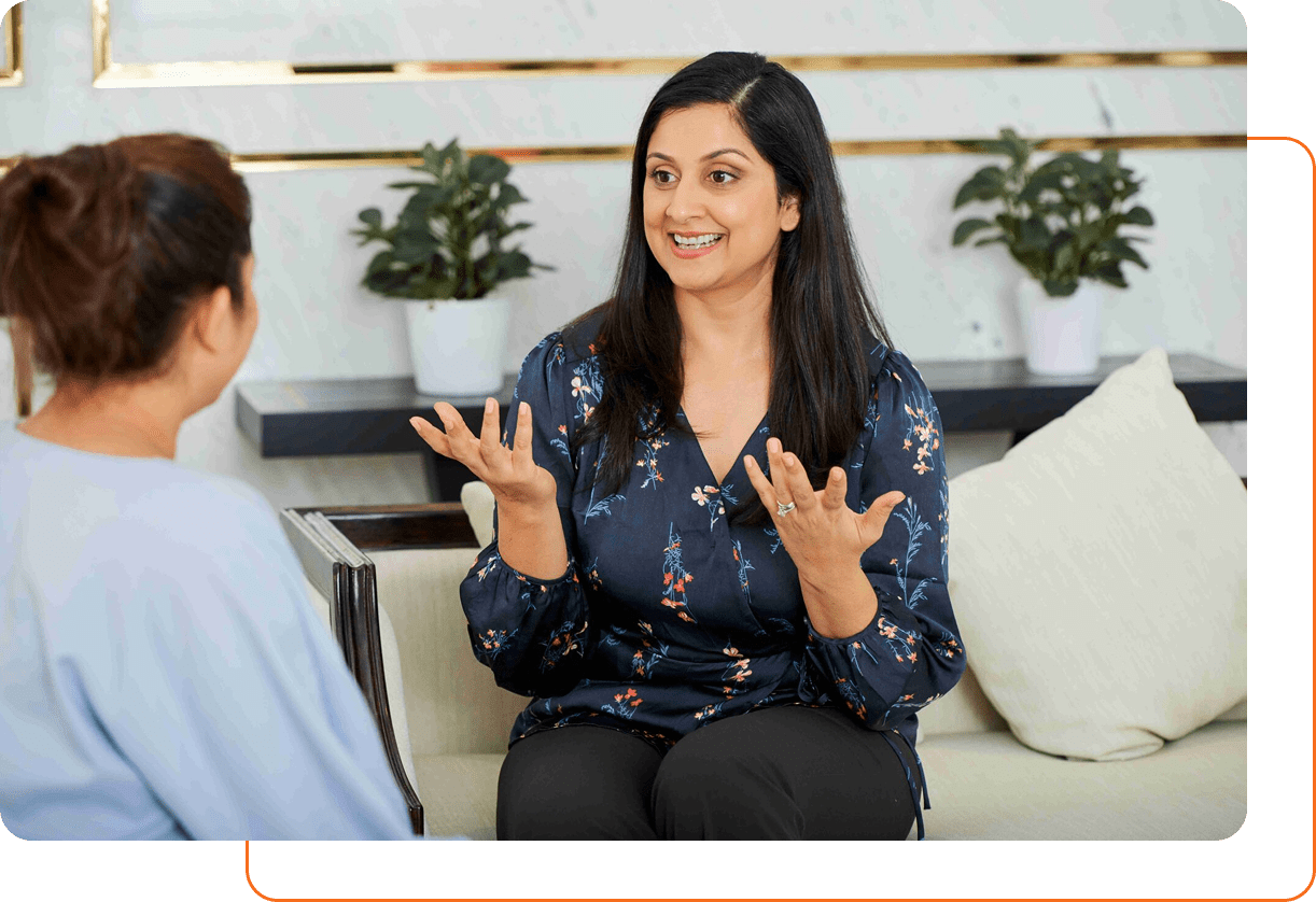 Woman explaining something enthusiastically in a conversation.
