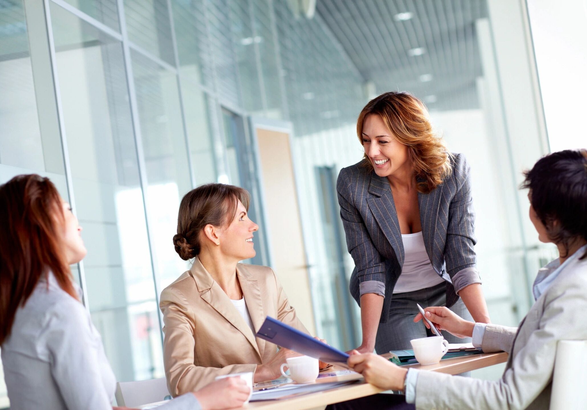Three professionals collaborating in a modern office setting.